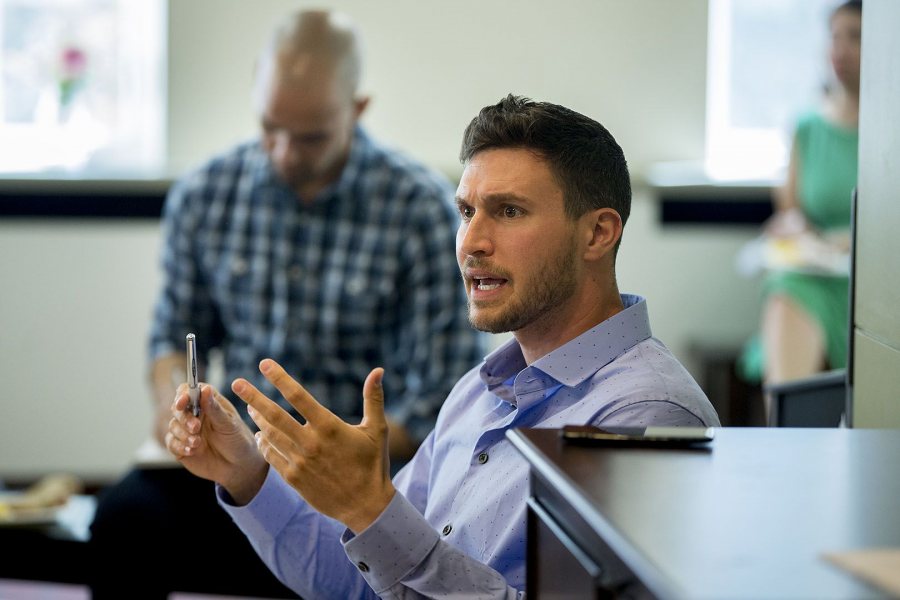 Christopher Petrella '06 makes a point during a meeting of the college's Justice and Equity Reading Group on Sept. 13, 2017. Petrella, faculty lecturer and associate director of programs for the Office of Equity and Diversity, is the group organizer. (Phyllis Graber Jensen/Bates College)