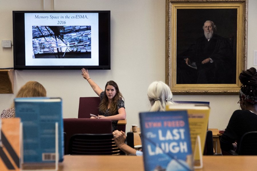 Stephanie Pridgeon, visiting assistant professor, Spanish, speaks on Burning the Revolution: Political Prisoners' Confiscated Books from Argentina's Dictatorship (1976-1983) during a Banned Books Week Talk in Ladd Library. (Theophil Syslo/Bates College)