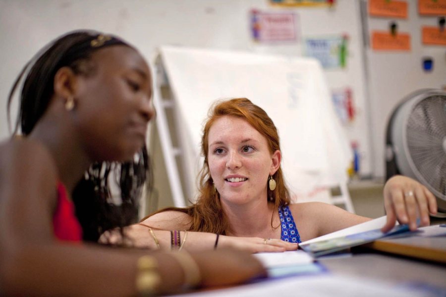 Brenna Callahan '15 works with a students at Montello School in July 2014. (Phyllis Graber Jensen/Bates College)