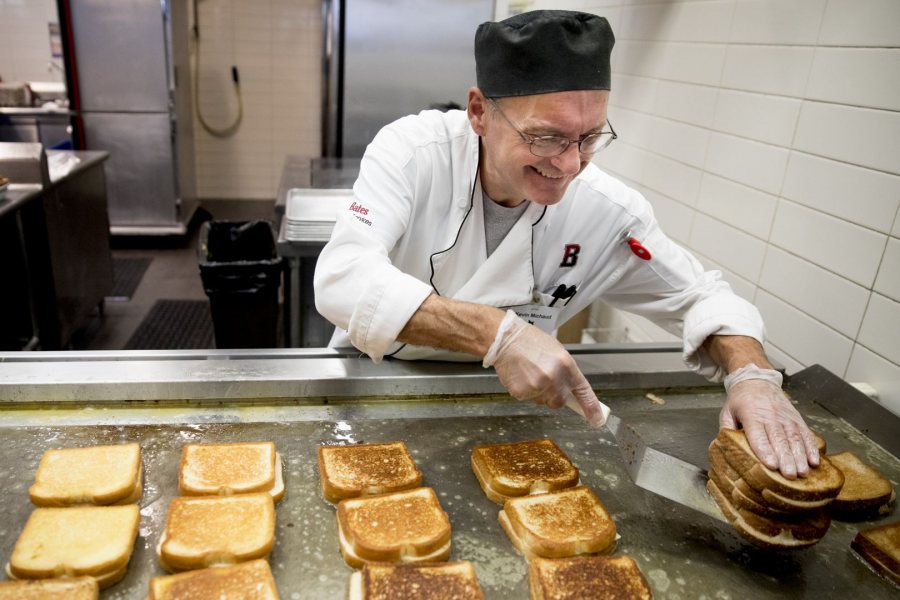 Kevin Michaud of Dining Services makes Commons’ beloved grilled cheese sandwiches for a recent Friday lunch. (Phyllis Graber Jensen/Bates College)