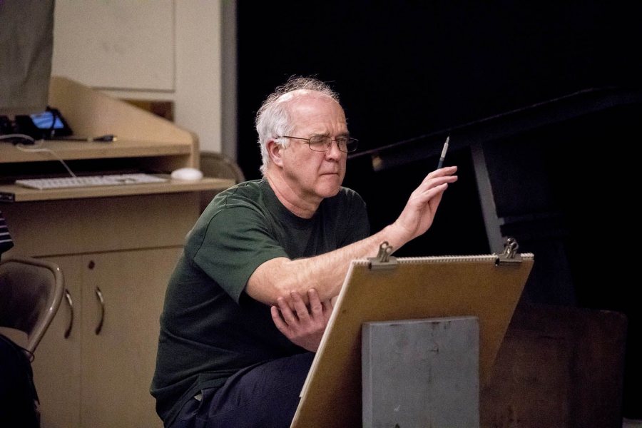 Joe Klofas of Hallowell, Maine, studies a new pose by a model during a March 2017 Life Drawing session in Olin 259. (Josh Kuckens/Bates College)