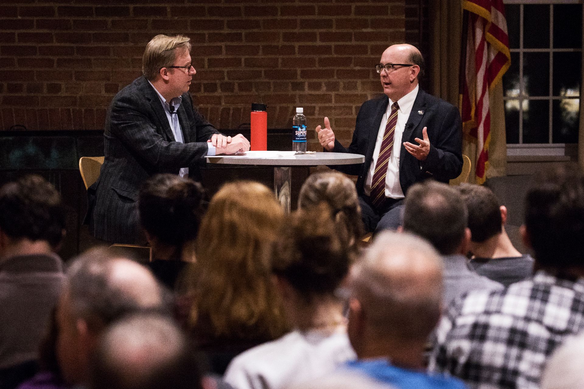 Moderator John Baughman, Associate professor of politics, listens as Matthew Dunalap, Maine Secretary of State, speaks on his work as a member of President Trump's Voter Fraud Commission, which the President disbanded after Dunlap sued the Commission for allegedly violation the Federal Advisory Committee Act while presenting during an event at Muskie Archives on February 28, 2018.