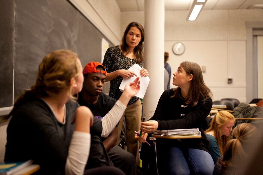 Assistant Professor of Education Mara Tieken circulates among small groups of students as they discuss what makes good teaching. Through fieldwork and classroom work, education students learn about the field’s interdisciplinary perspectives and the practical realities today.