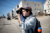 Zev Carter ’18 of Mattituck, N.Y., documents real estate on the corner of Maple and Park streets in Lewiston. As a participant in the Harward Center’s Short Term Action/Research Team, Carter is photographing and creating an archive of all the rental properties on the city’s “tree streets” for increased access to safe and affordable housing downtown. (Phyllis Graber Jensen/Bates College)

Healthy Homeworks (Amy Smith; amy.smith@healthyhomeworks.org; Zev Carter; Kristen Cloutier)

Contribute to a database of information on housing conditions in the Tree Streets neighborhood of downtown Lewiston

Mine publicly-available resources for information about housing conditions on select properties in a section of the Tree Streets neighborhood.

Take pictures of relevant properties.

Add data points to database.

Information will eventually help increase access to safe and affordable housing in the downtown.