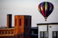 A hot air balloon rises from Simard-Payne Memorial Park in downtown Lewiston shortly after 6 a.m. on Aug. 19 during the Great Falls Balloon Festival. (Phyllis Graber Jensen/Bates College)

