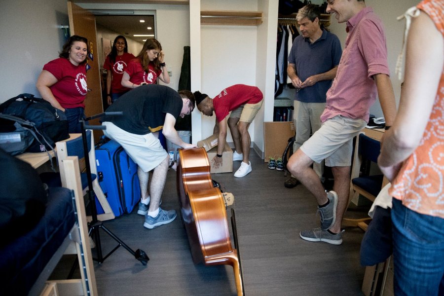 On Opening Day, as seen in 2018, new students get many helping hands from student members of the college's Residence Life staff. (Phyllis Graber Jensen/Bates College)