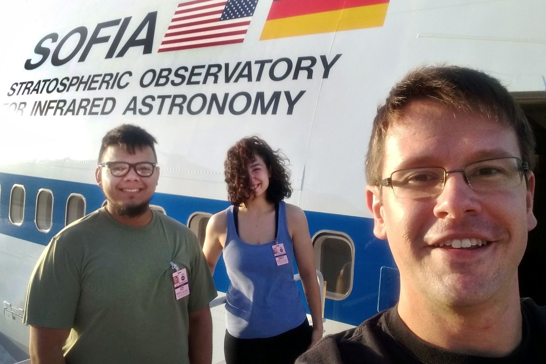 Aleksandar Diamond-Stanic, assistant professor of physics, snaps a selfie with his students, Jose Ruiz ’19 and Becca Minsley ’20, in front of SOFIA, the world's largest airborne observatory.