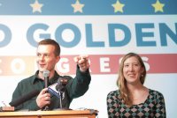 Jared Golden ’11 greets his supporters at the Franco Center in Lewiston late Tuesday night. On his right is his wife Isobel Golden ’11. (Russ Dillingham/Sun Journal)