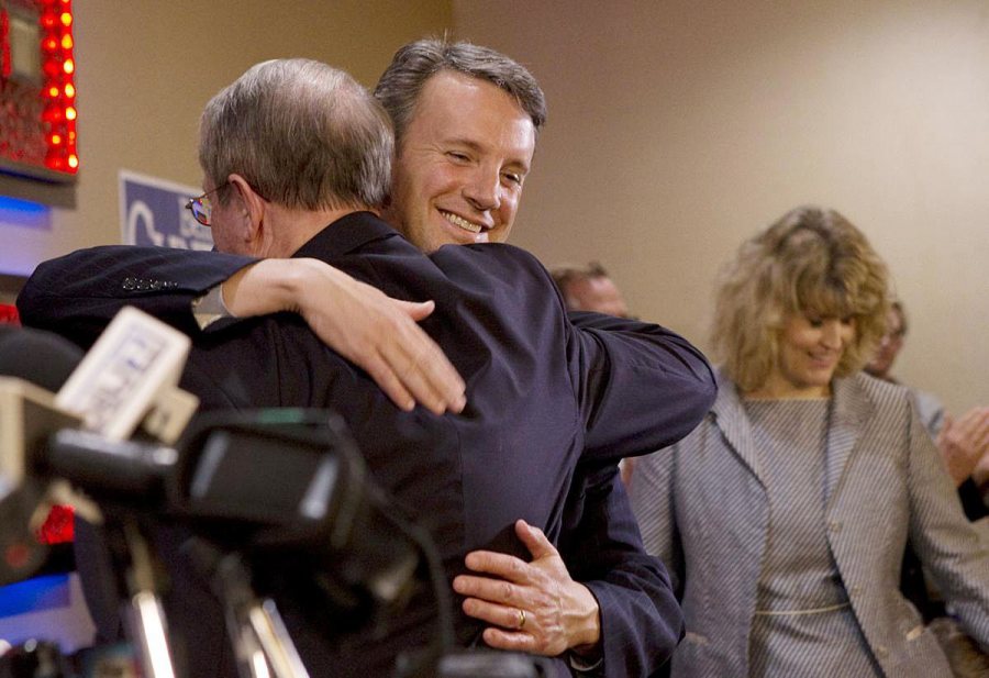 Ben Cline '94, R-Va., elected to the U.S. House on Tuesday night, hugs outgoing Rep. Bob Goodlatte '74 before giving his acceptance speech in Roanoke. (Heather Rousseau / copyright <em>The Roanoke Times</em>, reproduced by permission)