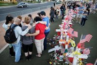 People pray at a makeshift memorial for victims of a mass shooting in Las Vegas on Oct. 9, 2017.  (AP Photo/John Locher, File)
