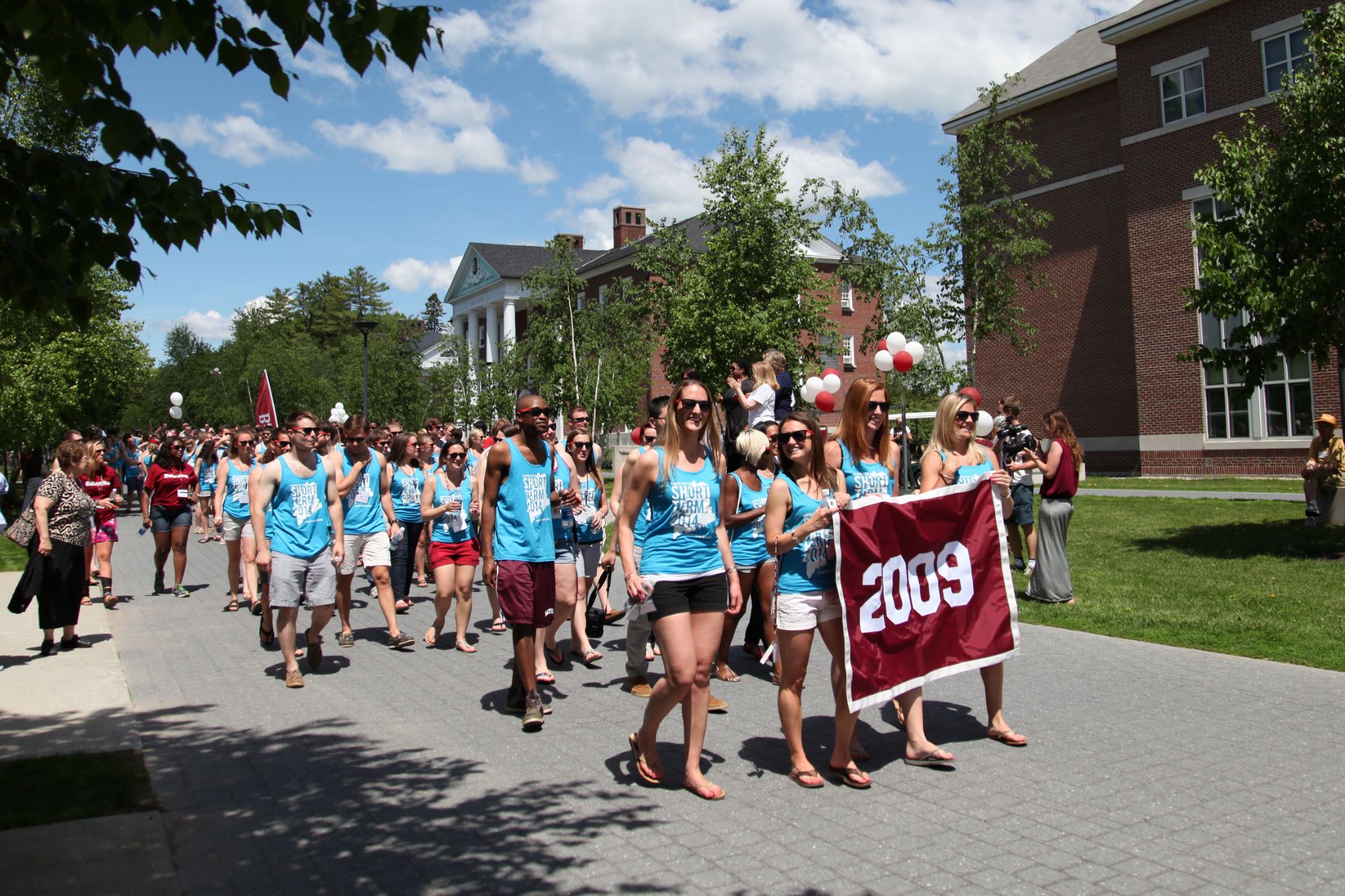 The Schuler Initiative will help Bates better engage with millennial alumni, roughly corresponding to the classes of 2002 to 2017. Here, members of the Class of 2009 march in the Reunion Alumni Parade on June 7, 2014. (Jay Burns for Bates College