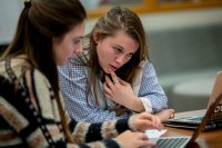 In this 2017 image taken in the Academic Resource Commons, Claudia Krasnow '18, peer writing and speaking assistant for a Spanish course, works with Madelyn Heart '18 on a paper. (Phyllis Graber Jensen/Bates College)