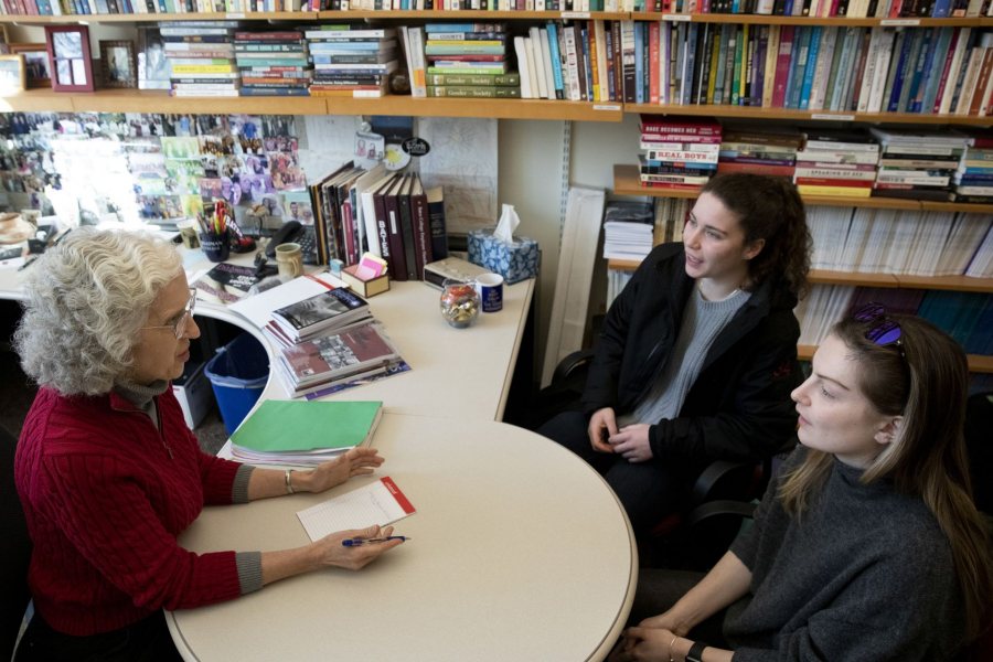 A day in the life of Pettengill Hall, featuring staff, faculty and students engaged in learning, studying, and working, with both internal and external images.

Professor of Sociology Emily Kane meets with Eliza Statile '19 (in black jacket) and Sydney Howard '19 (In gray sweater) in her second floor Pettengill office, Room 269, about plans for the sociology club they founded this year.