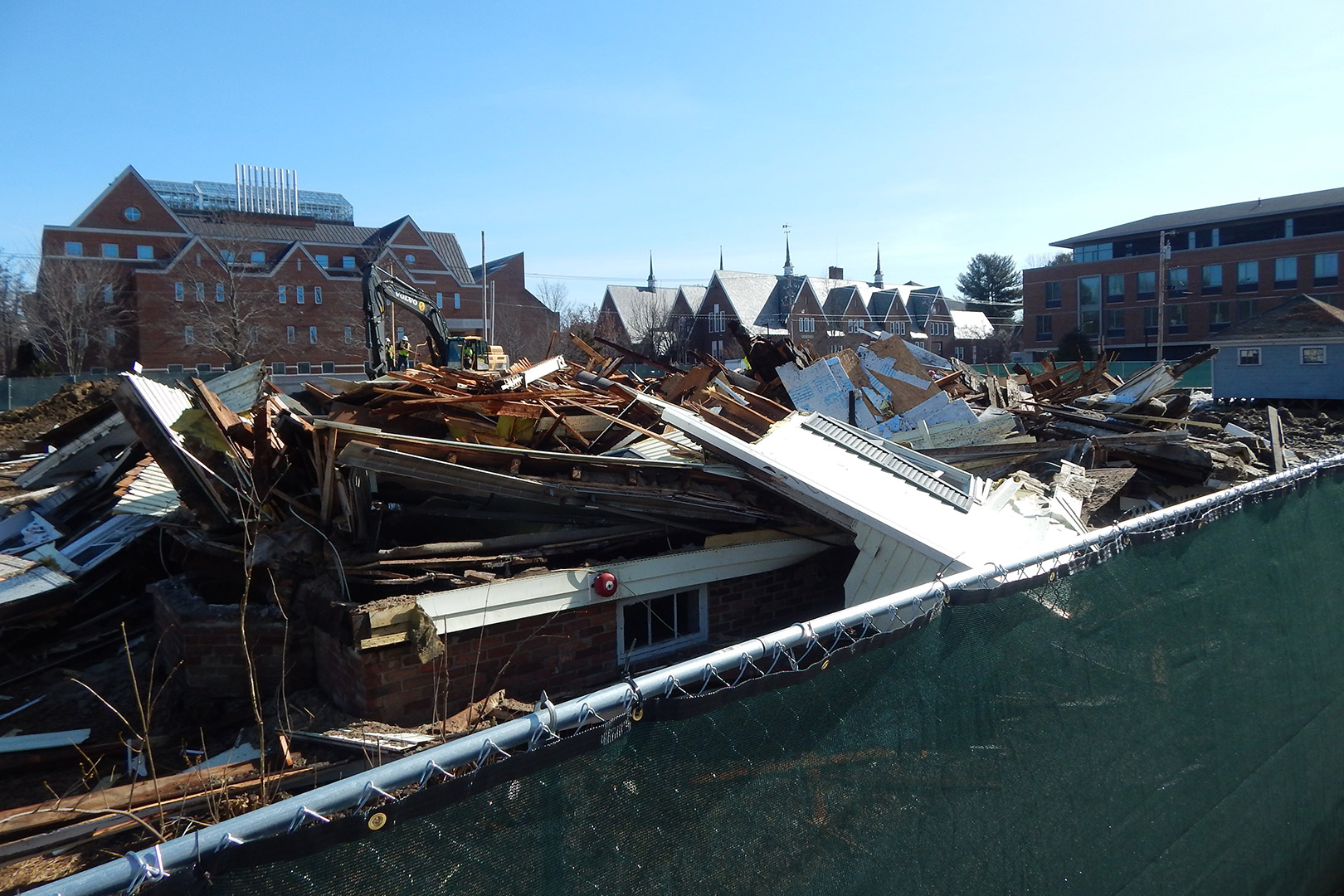 Seen over the construction fence, here's another view of 141 Nichols St. on March 28, with Carnegie Science, Chase, and Chu halls in the background. (Doug Hubley/Bates College)