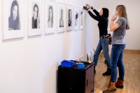 With the assistance of Environmental Studies major Haley Crim '19 who works in the Bates theater carpentry shop, Grace Link '19 hangs a series of her black and white photographic portraits in the Upper Gallery. (Phyllis Graber Jensen/Bates College)


Seniors in studio art install their work in the Bates College Museum of Art in the Olin Arts Center on the Monday afternoon of the week the exhibition opens.

Opening Reception: Friday, April 5th from 5:00-7:00pm
April 5-May 25, 2019
Since its dedication in 1986, The Bates College Museum of Art has maintained a special relationship with the collegeís Department of Art & Visual Culture. Part of this is a commitment to supporting the work of Bates students through our Annual Senior Thesis Exhibition. The exhibition highlights work selected from the thesis projects of graduating seniors majoring in Studio Art.

Thesis projects vary from student to student, each pursuing an individual interest. The emphasis of the program is on creating a cohesive body of related works through sustained studio practice and critical inquiry. The year-long process is overseen by Art and Visual Culture faculty, and culminates in this exhibition.

Other exhibiting students include:
 
Flannery Black-Ingersoll
Jo Cunningham
Sarah Daehler 
Daisy Diamond
Meha Jhajharia
Lily Kip
Morgan Lewis
Grace Link
Mickai Mercer
Erica Moore
Abigail Myers
Bailey Richins
Chandler Ryan
Anh Thai Tran