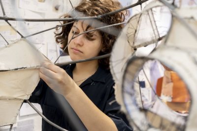 Studio art thesisStudent in blue top and pants with brown pants working on mixed media and figure painting is Flannery Black-Ingersoll '19 of Concord, N.H., a double major in studio art and mathematics;Student in blue coveralls is Daisy Diamond '19 of Bala Cynwyd, Pa. , a studio art major working with art, steel, and fabric.