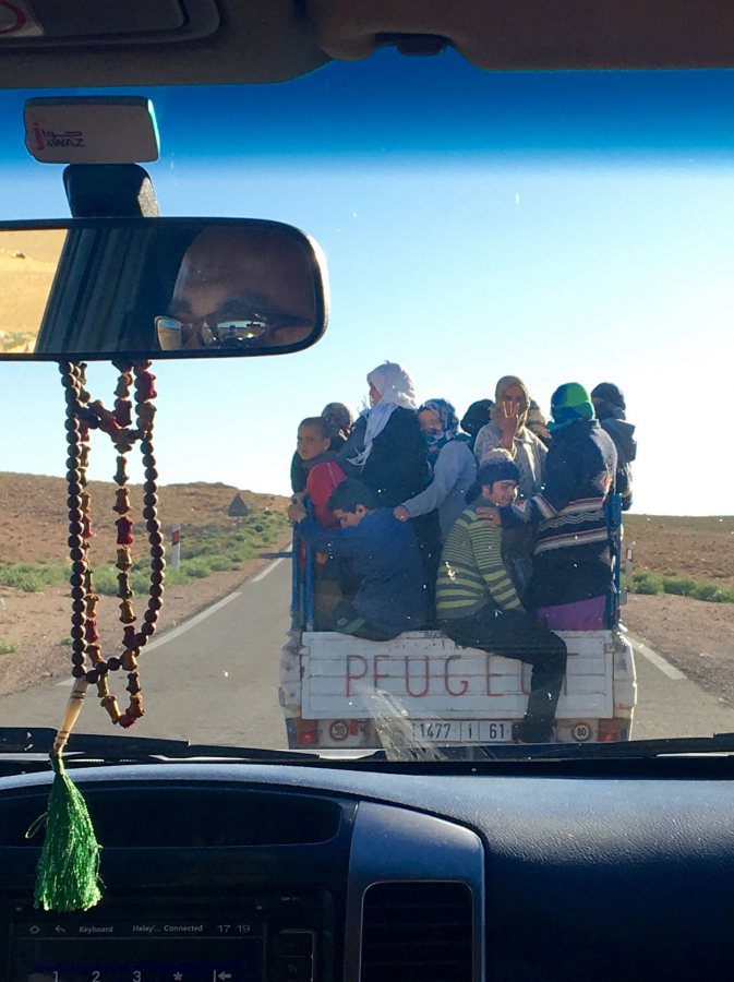 Crim, Haley IHP Climate Change (Multi-Country) Spring 2018 After spending a week studying environmental protest in Morocco, our van got stuck behind the only other car on the road: a truck full of activists from the Imider protest camp, the longest running environmental protest on earth. The woman in the middle is giving the sign of the movement, which our driver returned in solidarity. The activists had spent the day protecting a water main valve that they shut off so that a nearby silver mine couldn't deplete the water used by local people. This truck was heading home as another shift came to take their place, as they have been doing for the past 8 years. This photo was selected for the 2019 Barlow Off-Campus Photography Exhibition and shown at the 2019 Mount David Summit on March 29, 2019.