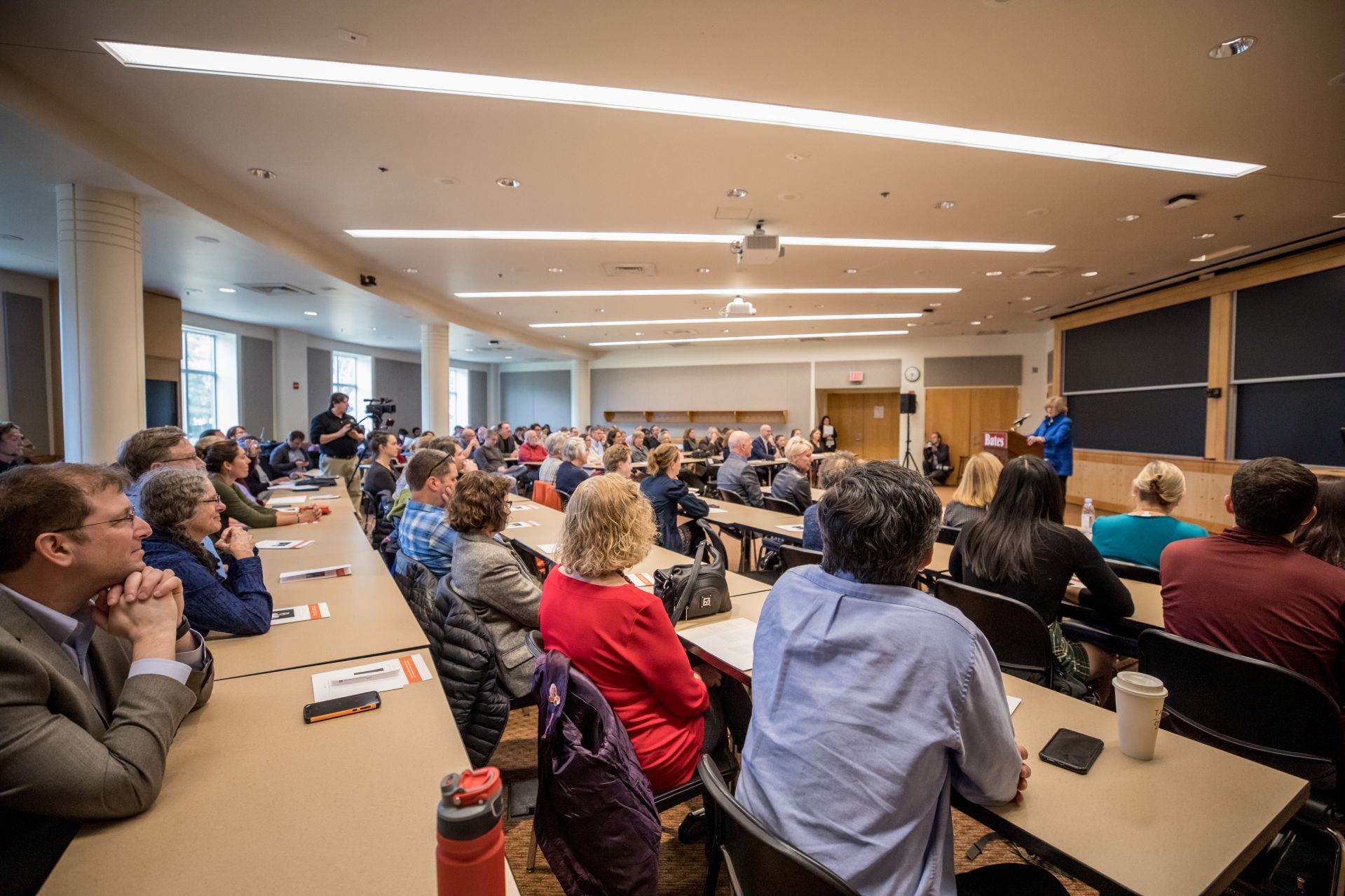 In front of a packed Pettengill Hall classroom, President Clayton Spencer welcomes listeners to April Hill’s inaugural lecture as Wagener Family Professor for Equity and Inclusion in STEM. (Rene Roy for Bates College)
