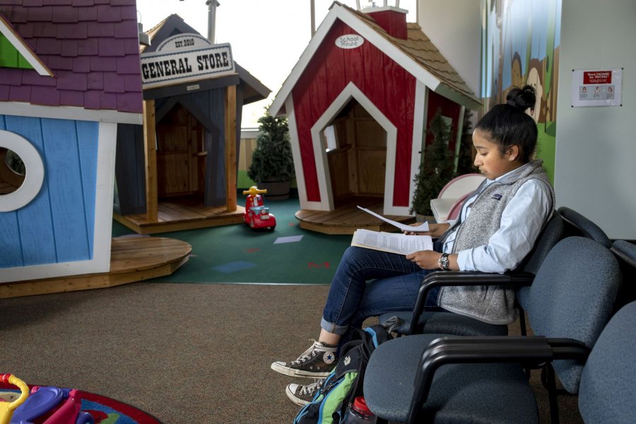 Maya Seshan '20 poses in front of and in waiting room of Pediatric Associates in Lewiston.STA/RT program with Harvard Center for Short Term 2019 Hometown: Wilton, CT Politics Maine Gun Safety Coalition This project involved conducting a study of Maine pediatrics offices about how frequently pediatricians speak with parents about firearm safety in the home, firearm storage, and methods of keeping children away from firearms; an exploration of best practices, and greatest needs for pediatricians around these conversations. The final goal was to develop a brochure that pediatricians can provide to parents on the topic.