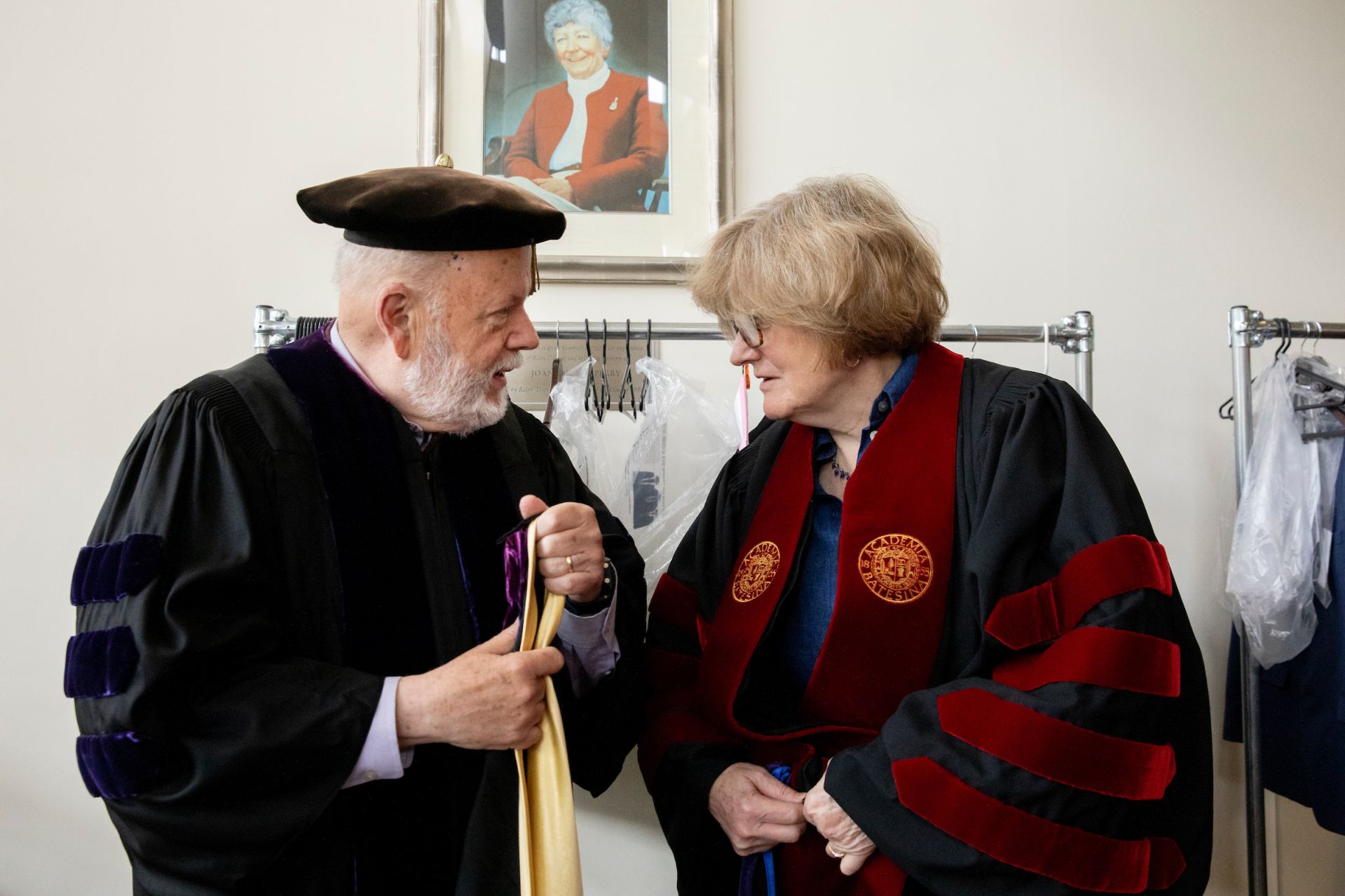 Bates College 2019 Commencement (the one hundred and fifty-third) on the Historic Quad, at which Travis Mills receives an Doctor of Humane Letter. Placing the collar on Mills is the college's mace bearer, Charles Franklin Phillips Professor of EconomicsMichael Murray.