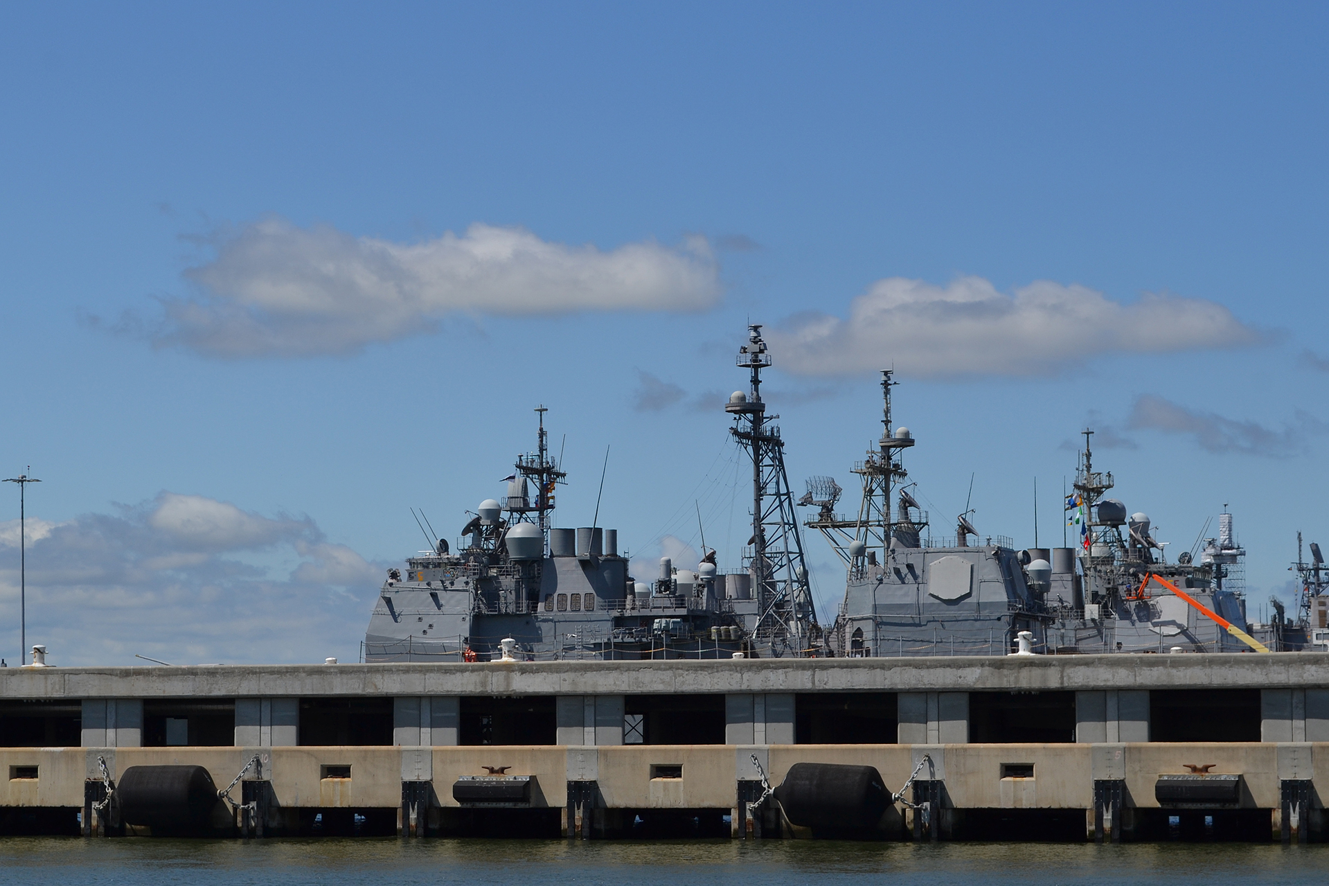 The Navy has added a second deck to some piers at Naval Base Norfolk to accommodate higher water levels and expedite the handling of cargo. (Lynne Lewis for Bates College)