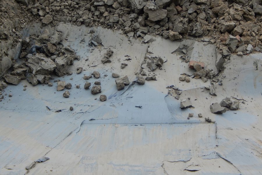 Marine clay on the floor of the Bonney Science Center foundation hole shows marks from the scoop of an excavator. (Doug Hubley/Bates College)