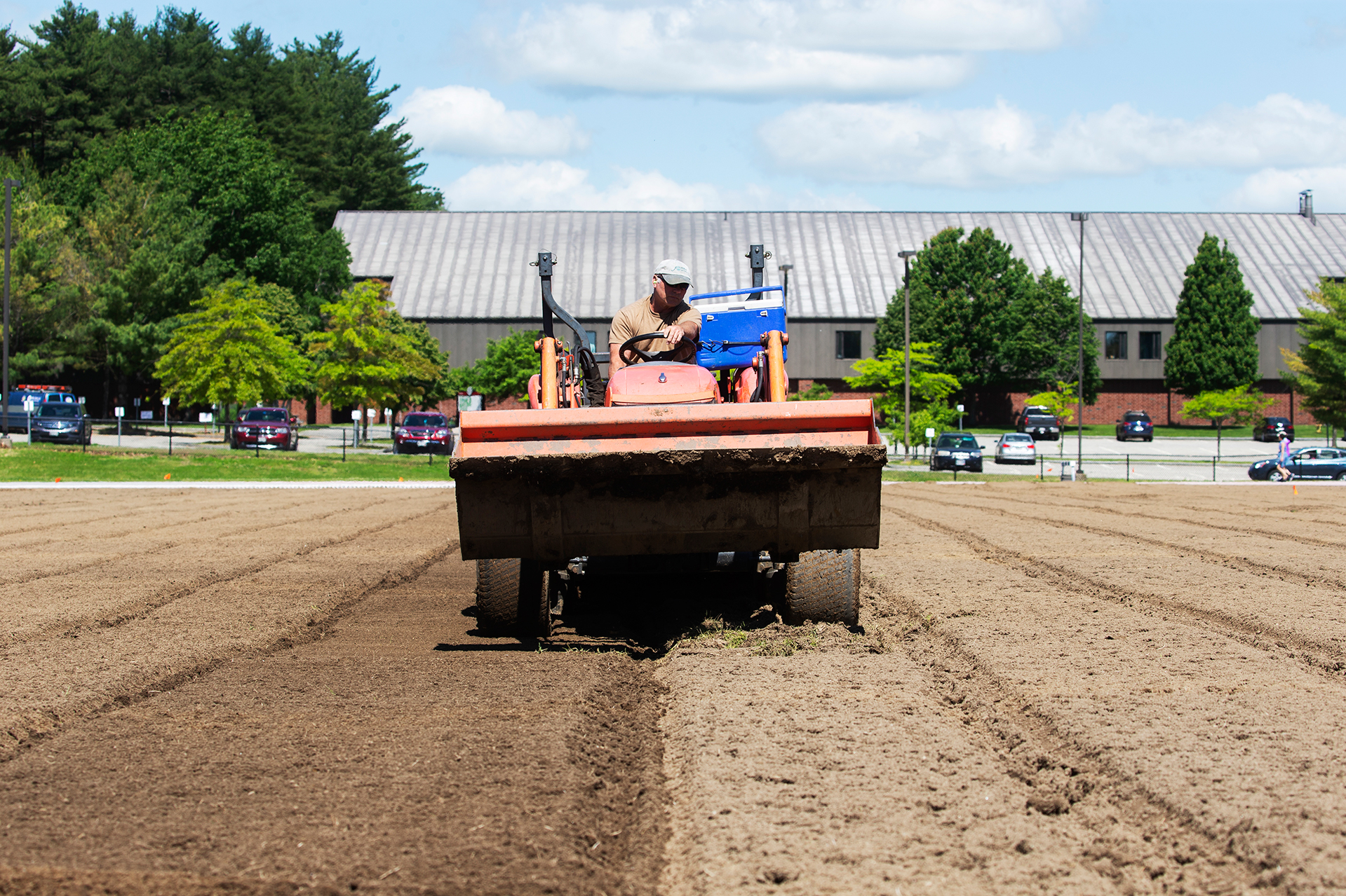 A laser-guided land leveler prepares the Russell Street soccer field for its new sod in mid-June. (Theophil Syslo/Bates College)