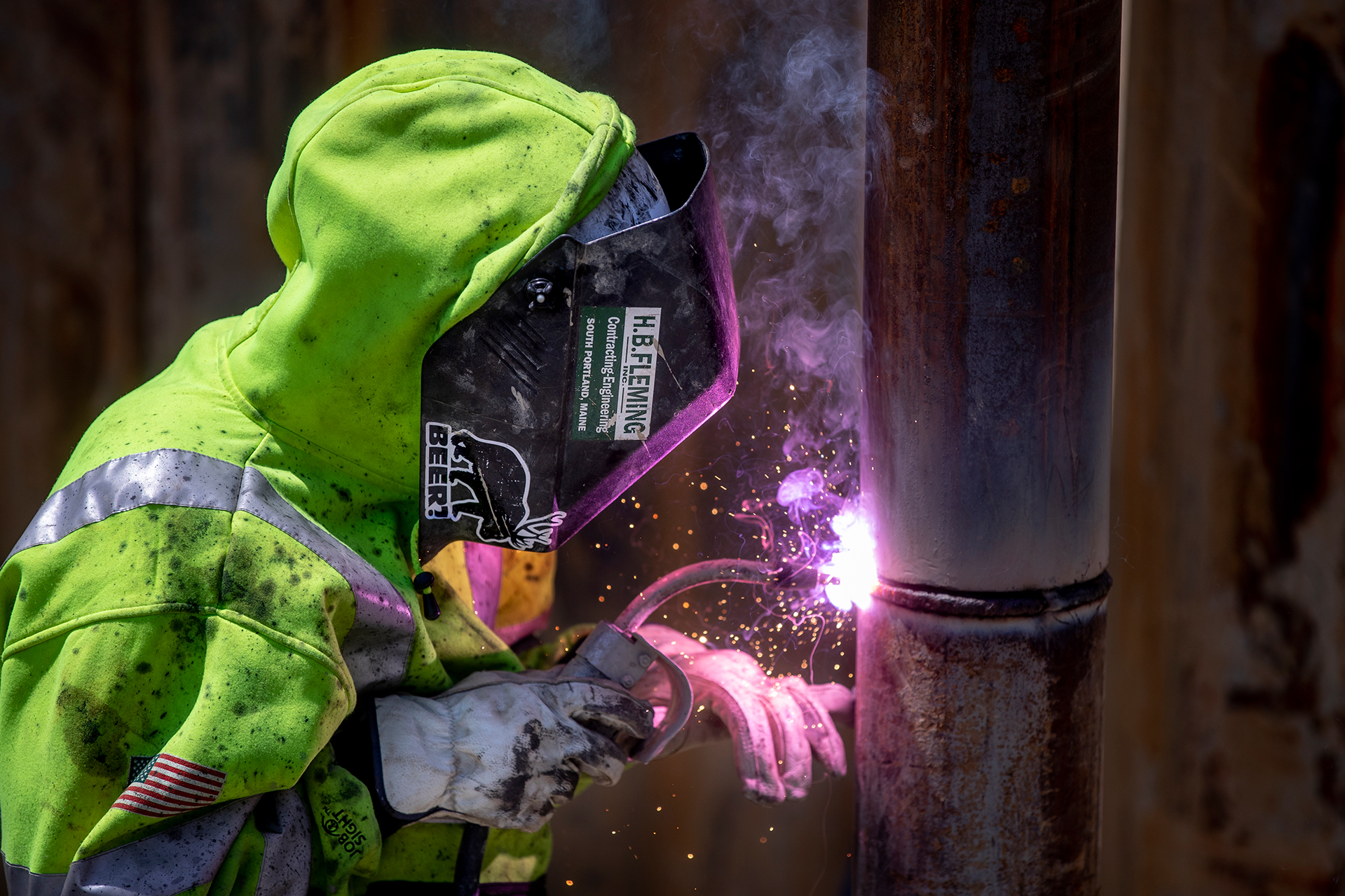 Welding a splice joining two sections of pipe pile. (Phyllis Graber Jensen/Bates College)