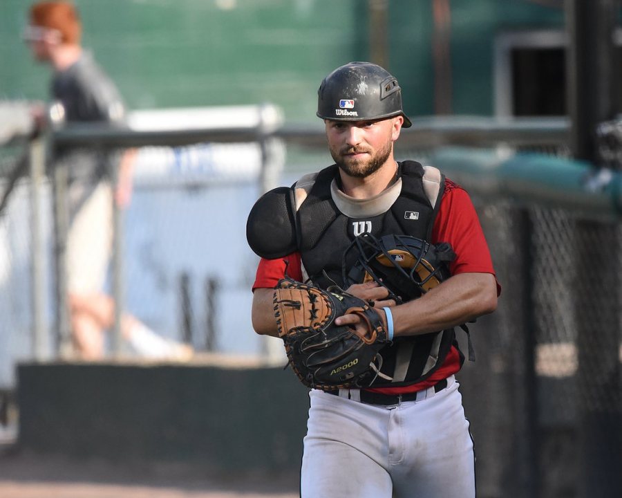 Standout Bates catcher Jack Arend '20 dons the so-called tools of ignorance for a July 21 game vs. Bristol Blues. (Photograph by Peggy Arand '20)