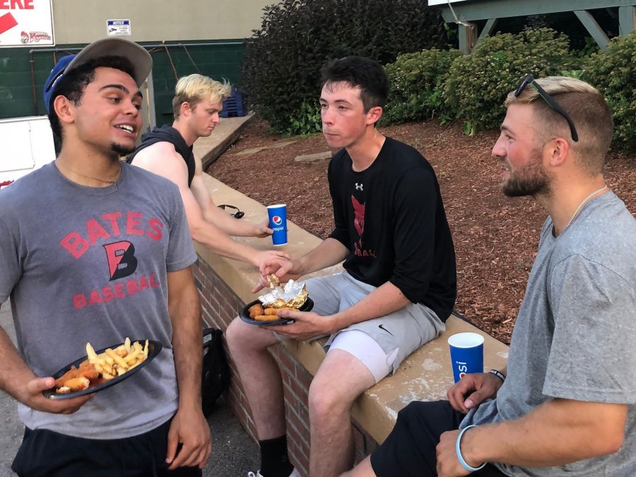 Following their July 21 game in Nashua, the four Bates players on the Nashua Silver Knights and Bristol Blues chow down on a post-game meal. From left, Christian Beal ’21 (Bristol), Nolan Collins (Nashua), Miles Michaud ’20 (Bristol), and Jack Arend ’20 (Nashua). (Photograph by Peggy Arend)