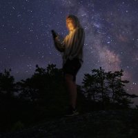 Ryan Mahoney ’20 Virginia Tech, Environmental Resources Management, working with Maine Coast Heritage Trust which placed me with KELT (Kennebec Estuary Land Trust), posses for a portrait using his photne to lit himself while watching the cosmos from on top of "The Rock" overlooking Meetinghouse Pond at The Coastal Center at Shortridge on July 29, 2019. He states:"As for my little biography, I was born and raised in Reston, Virginia and have lived there my whole life. Now I am going into my senior year at Virginia Tech majoring in 'Environmental Resources Management' and getting minors in 'Forestry' and Watershed Management'. This Summer, I got the opportunity to work with Maine Coast Heritage Trust which placed me with KELT (Kennebec Estuary Land Trsust). I wanted this internship because I knew it would give me experiences in the field of environmental conservation that I otherwise would not have been able to have. Staying at Shortridge this Summer has been an absolute blessing and I will forever cherish my time here forever.""Growing up, I always loved to look at the night sky and stars. When there was a meteor shower or celestial event, my parents would wake me up in the middle of the night and drive me and my siblings out to a field where we could see the sky with the least amount of light pollution possible. Last night at Shortridge was my first time seeing a truly clear night sky with no light pollution and it was absolutely breathtaking. Words cannot do justice for what I saw last night. Looking up, I could see the whole Milky Way, more stars than imaginable, and even space stations or satellites floating in the endless wonder. Standing up on that rock and looking at the intricacies of the universe flushed me with feelings of wonder, astonishment, and excitement. Those moments are the moments I chase in life and I hope to see a sky like that again sometime soon."