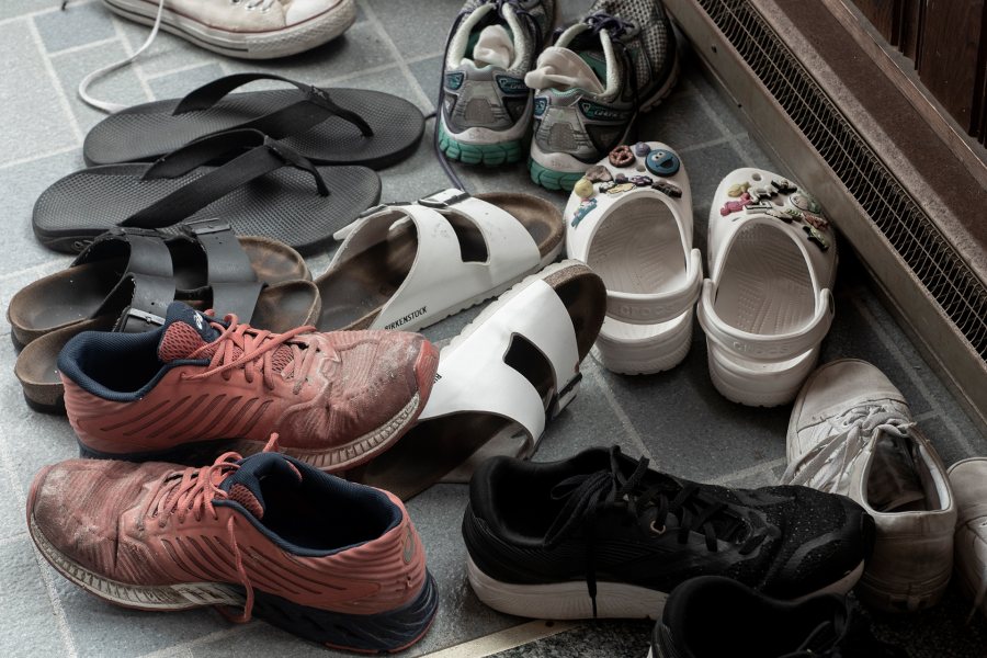 "The gathering of shoes": Generations of family and friends visiting Jean and Bill Holt in Ocean Park leave their footwear at the door. (Phyllis Graber Jensen/Bates College)