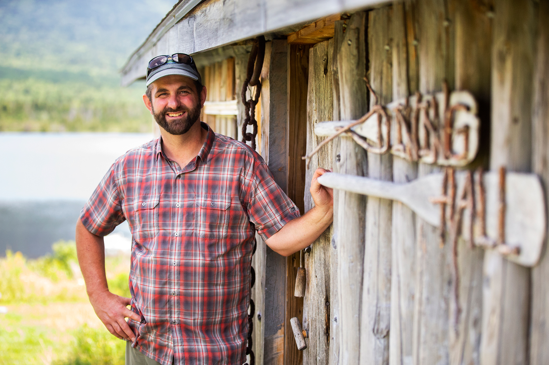 Eric Stirling í97, West Branch Pond Camps (wilderness sporting camp), posses for a portrait outside the Dinning Hall during a tour on August 9, 2019.