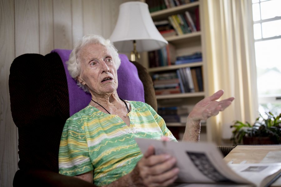 Dorothy Foster Kern '42 speaks with Bates Communications Office writer Emily McConville in the living room of her 64 Grandview Avenue home in Auburn, Maine. McConville brought some Bates memorabilia for Kern to inspect.Kern will turn 100 on Sept. 23, 2019. She retired in 1980 after 20 years of being the librarian at Edward Little High School.