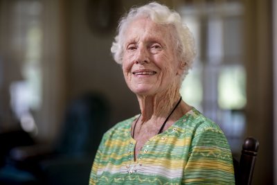 Dorothy Foster Kern '42 speaks with Bates Communications Office writer Emily McConville in the living room of her 64 Grandview Avenue home in Auburn, Maine. McConville brought some Bates memorabilia for Kern to inspect.Kern will turn 100 on Sept. 23, 2019. She retired in 1980 after 20 years of being the librarian at Edward Little High School.