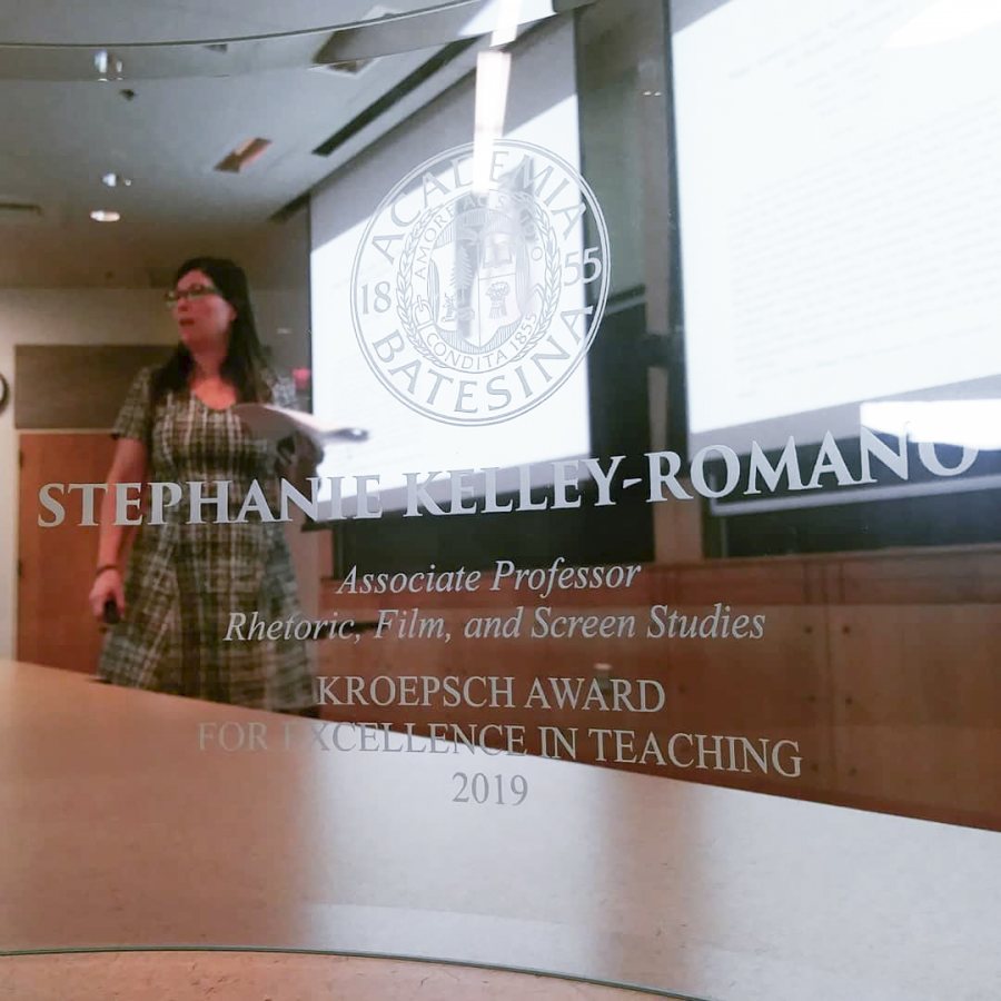 Stephanie Kelley-Romano as seen through her transparent Kroepsch Award. (Photograph by Jonathan Cavallero)