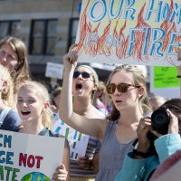 Left, Tamsin Stringer '22 of Bloomington, Ind., (system change not climate change) and Reilly Dwight '22 of Sebastopol, Calif. (our home is on fire) and in green jacket and black shirt on right, Ashka Jhaveri '22 of Chappaqua, N.Y.“I can't believe I'm even having to protest this.”.— Muskan Verma '21 of Shimla, India, shares the frustration of inaction on global climate change after she addressed a crowd of at least 2,000 at Portland City Hall gathered for the student-mobilized Global Climate Strike, ahead of the opening of the United Nations General Assembly and the Climate Action Summit on Sept. 23..“I'm not from this country,” she said. “But that shouldn't matter. This is affecting us all. And whether we like it or not, we have to take action.”.A representative of the Sunrise Movement, a youth-led movement for climate-change action, Verma is a double major in theater and in rhetoric, film, and screen studies. She joined a large contingent of Bates students and several faculty who attended the event, organized, in part, by the Bates Environmental Coalition..