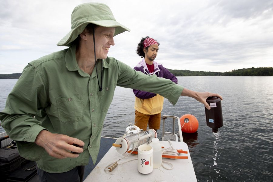 Supervised by Holly Ewing, Christian A. Johnson Professor of Interdisciplinary Studies, environmental studies major Christopher Castaneda ’20 takes water samples from Lake Auburn. He’s studying nutrients produced by algae and consumed by other organisms in the lake. Related to the impacts of algae blooms on water quality, the research supports community efforts to deliver unfiltered public water at the lowest price. On the boat with Water treatment manager and lab director Chris Curtis (in blue shirt) and Lindsay Bates and Dan Fortin, water quality technicians (Bruins sweatshirt)