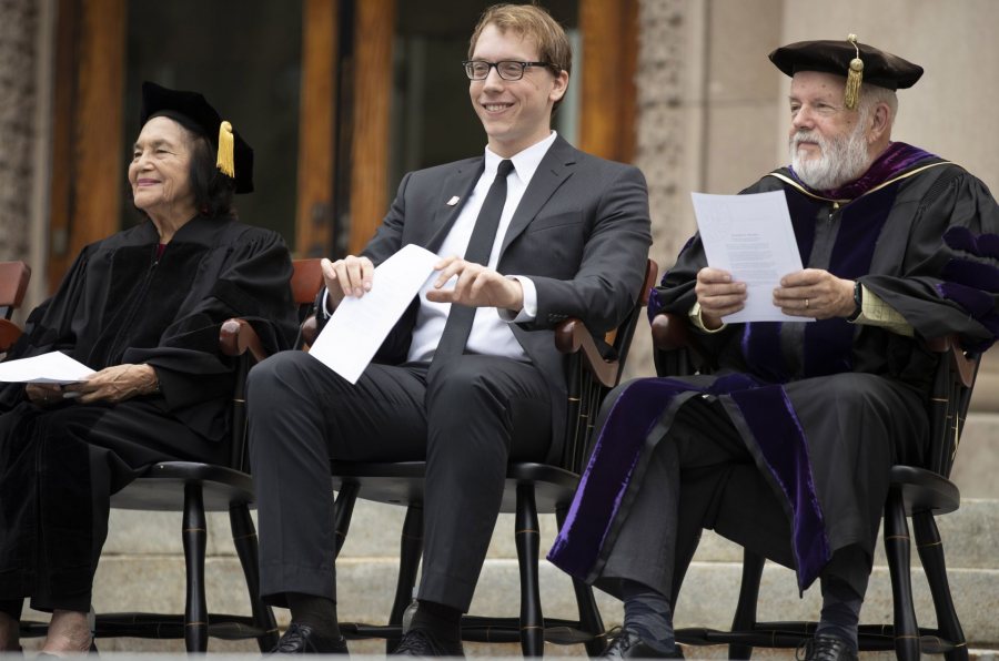 At Opening Convocation on Sept. 3, Ryan Lizanecz ’20 (center) sits between keynote speaker and honorand Dolores Huerta and Phillips Professor of Economics Michael Murray. (Phyllis Graber Jensen/Bates College)