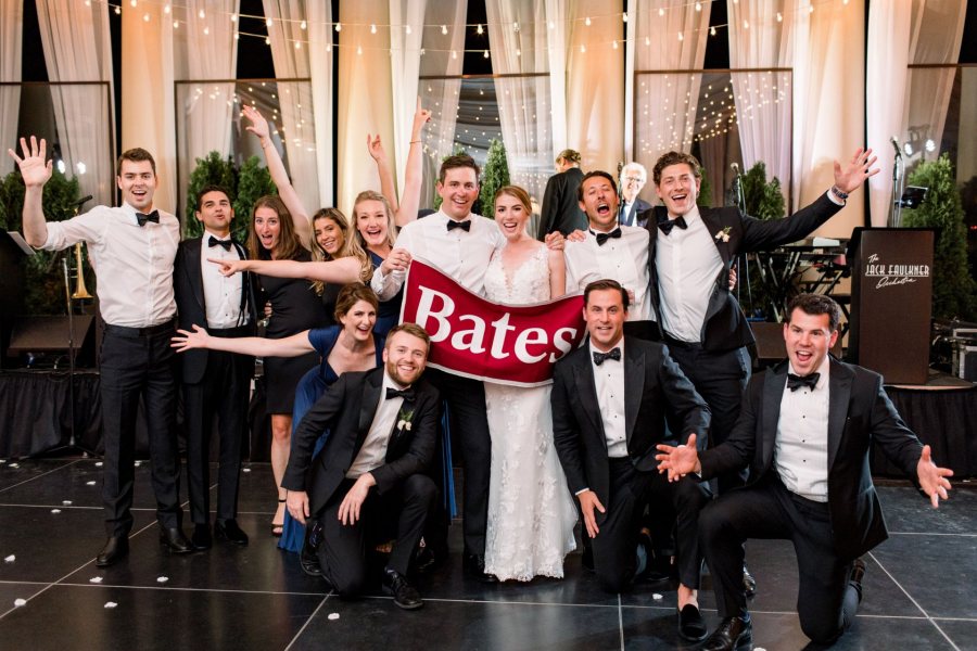 Tess Glancey '12 and Rob Crampton '13 pose with Bates friends at their wedding reception on Aug. 30, 2019 in Philadelphia. 