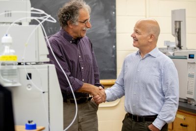 Jim Weissman '84, Chief Business Officer at Dicerna Pharmaceuticals, Inc., is establishing a scholarship in honor of tCharles A. Dana Professor of Chemistry and Biochemistry Tom Wenzel, who is teaching for his last year in 2019-20. The scholarship fund will benefit summer research opportunities, an area that Tom, when asked, would like to see funded through philanthropy. Jim was one of Tom's thesis students whose work was subsequently published.Also in the photographs, posed in laboratories in Dana Chemistry, are Kyoko Weissman, Jim's wife and Associate Professor of Chemistry Matt Côté along with the following chemistry students:Jake O' Hara '21 in green, Shanzeh Rauf '21 in purple, Maddie Murphy '20 in stripes, Owen Bailey '22 in stripes, and Nick Jones /20 in red.