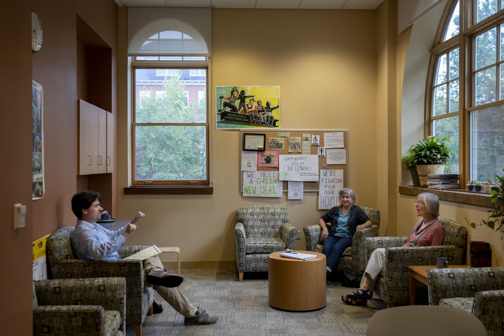 Costlow meets with members of the Otis Committee, including Assistant Professor of Philosophy Paul Schofield and Professor of English Lillian Nayder in Hedge Hall’s Environmental Studies Lounge. (Phyllis Graber Jensen/Bates College) 