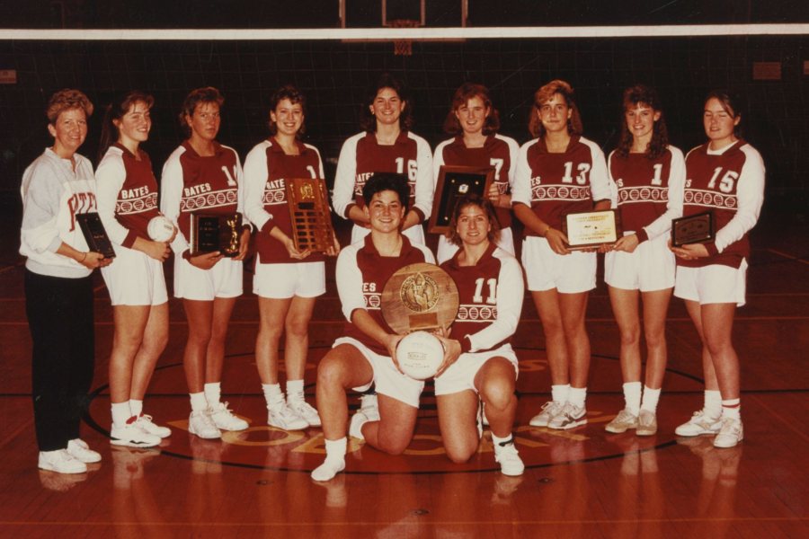 The Bates volleyball team with the ECAC Championship trophy. Back row from left to right: Marsha Graef, Cindy Simonides Farina '93, Jennifer White Campbell '91, Laurie Plante Graumann '90, Rachel Clayton '90, Julie Roche Simplicio '91, Andrea Corradini '92, Allyson Reynolds Wachtel '93, Nicole Bolduc Schmidt '90. Front row from left to right: Michele Feroah '90, Cathy Meoni Ringling '90. 