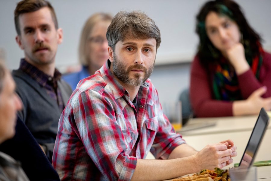 Travis Gould is chair of both the physics department and the college's Committee on Environmental Responsibility. He is shown in that role during a meeting last May that confirmed that Bates had attained carbon neutrality. (Phyllis Graber Jensen/Bates College)

Travis Gould