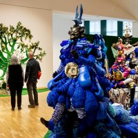 During a visit to Bates College, students from the Tripp Middle School in Turner stop for a tour of the Bates Museum of Art, where they view two exhibitions on display.Upstairs: "Vanessa German:Miracles and Glory Abound" (October 25, 2019 ñ March 28, 2020)Downstairs: "Ralph Eugene Meatyard:Stages for Being (October 25, 2019 ñ March 28, 2020)Louise Ouillette, Bates Museum of Art attendant, and Tony Leavitt, a science teacher at the Tripp Middle School, takes a closer look at Vanessa German's art work in the Upper Gallery of the Museum.