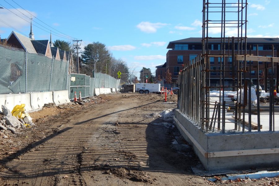 Part of November's progress at the Bonney Science Center was backfilling that buried the foundation walls, as well as the steel sheet piling that kept the foundation hole open early in the construction process. The white trailer is a space heater. (Doug Hubley/Bates College)