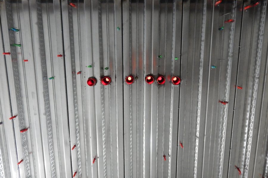 Colorful Bang-It brand fasteners stud the floor decking above the science center basement. (Doug Hubley/Bates College)