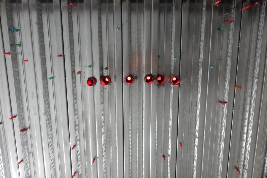 Colorful Bang-It brand fasteners stud the floor decking above the science center basement. (Doug Hubley/Bates College)