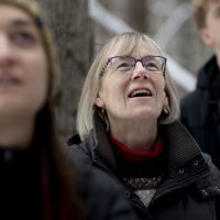 From left, Wilder Geier ‘22, Lars Schuster ’20, and Julian Cook ’20 take a look at a pileated woodpecker in Lewiston’s Thorncrag Bird Sanctuary..Nick Lund of Maine Audubon @maineaudubon spotted the bird as he led Clark A. Griffith Professor of Environmental Studies Jane Costlow and students in her “Living With Animals” course on a midday birding excursion during their last class session.