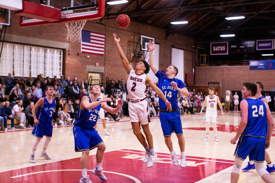 Men's basketball resumes for the new year on Jan. 2. Shown on Dec. 7 is Stephon Baxter of Worcester, Mass., during the Bobcats' 84-69 victory over St. Joseph's College of Maine. Baxter scored a team-high 15 points during the game. (Theophil Syslo/Bates College)